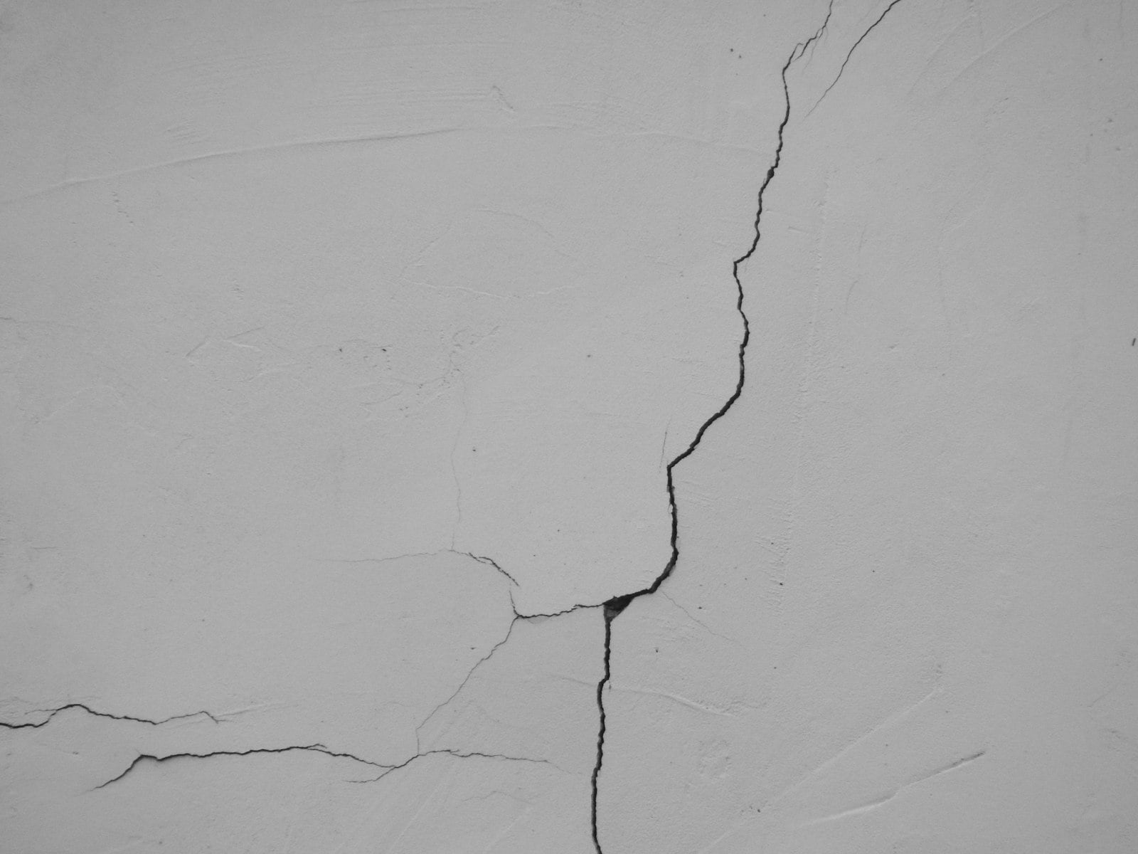 Branching crack in a white interior wall