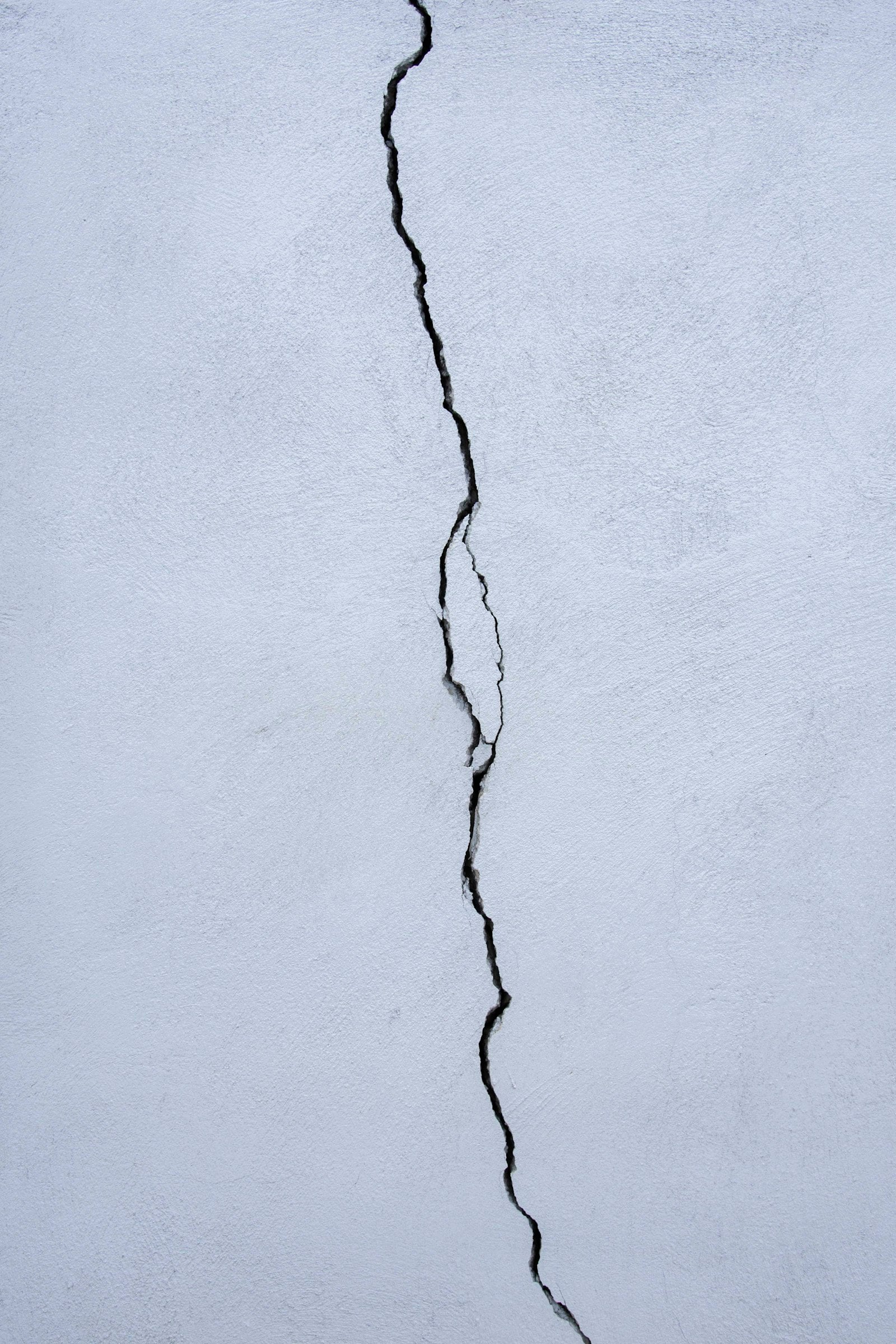 Thin diagonal crack in a plastered wall